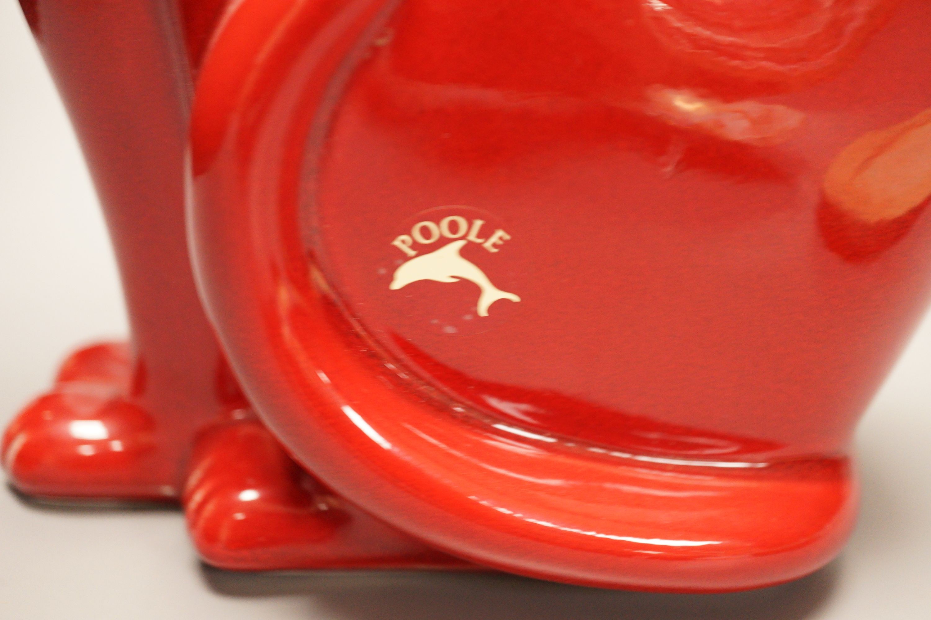 A Poole Delphis cat, a Doulton Lambeth soap dish and two Limoges dishes, tallest 29cm